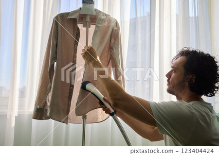 Steam cleaning your garments ensures a crisp, polished finish that enhances their appearance Steam cleaning your garments ensures a crisp, polished finish that enhances their appearance 123404424