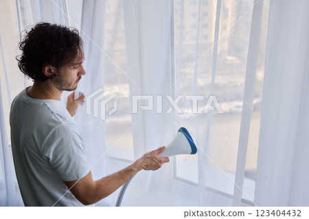 Steam cleaning curtains gives them a vibrant look, enhancing home Steam cleaning curtains gives them a vibrant look, enhancing home 123404432