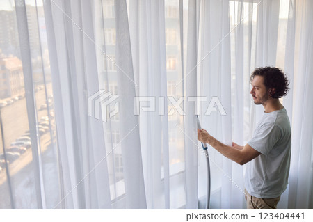 Steam cleaning curtains gives them a vibrant look, enhancing home Steam cleaning curtains gives them a vibrant look, enhancing home 123404441