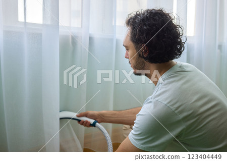 Steam cleaning curtains gives them a vibrant look, enhancing home 123404449