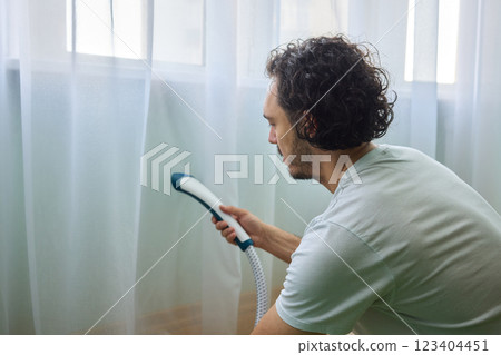 Steam cleaning curtains gives them a vibrant look, enhancing home 123404451