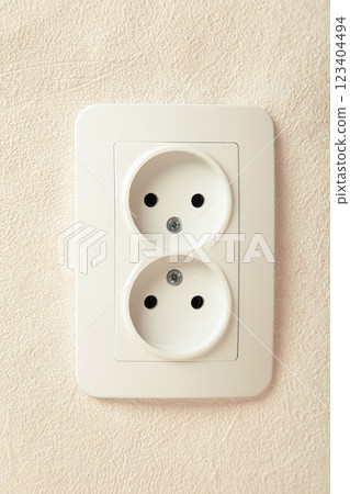 White double socket on wall - electric plug White double socket on wall - electric plug 123404494