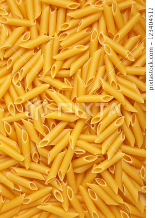 Penne Rigate pasta background. Vertical photo Penne Rigate pasta background. Vertical photo 123404512