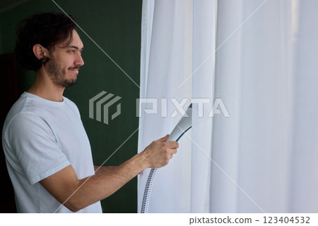 Steam cleaning curtains gives them a vibrant look, enhancing home 123404532