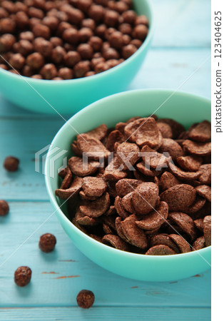 Set of various breakfast cereals on blue background. Vertical photo 123404625