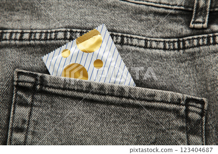 Condom in black jeans pocket, Protect yourself use a condom. Condom in black jeans pocket, Protect yourself use a condom. 123404687