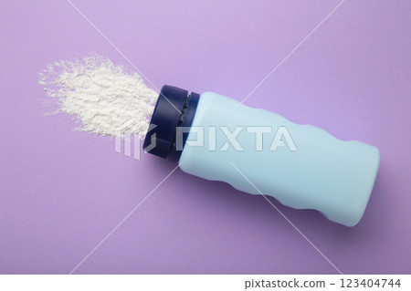 Baby powder on purple background. Baby cosmetics. Space for text 123404744