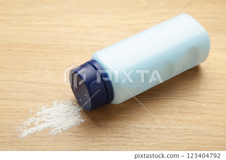 Baby powder on light background. Baby cosmetics Baby powder on light background. Baby cosmetics 123404792