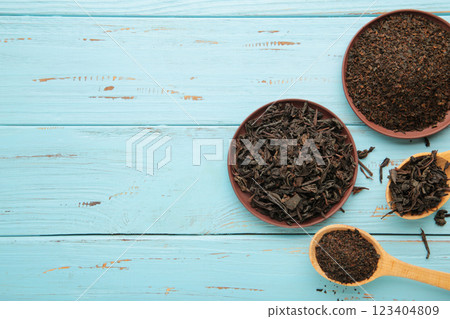 Assortment of dry tea on blue wooden background. Space for text Assortment of dry tea on blue wooden background. Space for text 123404809