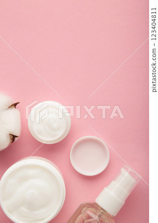 Face cream moisturizer in a jar on pink background. Luxury skincare cosmetics and anti-aging product for healthy skin and beauty routine Face cream moisturizer in a jar on pink background. Luxury skincare cosmetics and anti-aging product for healthy skin and beauty routine 123404811