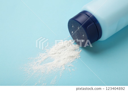 Baby powder on blue background. Baby cosmetics. Space for text 123404892