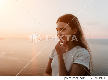 Young Girl Contemplating at Sunset 123404911