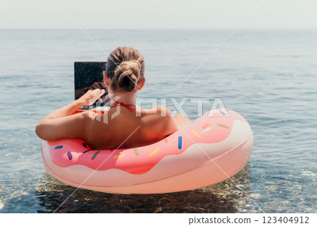 Woman Laptop Donut Float Ocean Beach Summer Vacation 123404912