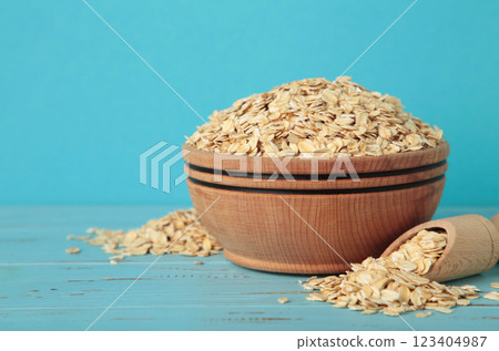 Oatmeal in bowl on blue wooden background 123404987