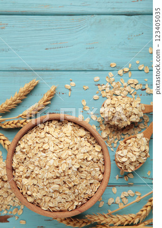 Oatmeal in bowl on blue background. Healthy eating concept. Oatmeal in bowl on blue background. Healthy eating concept. 123405035