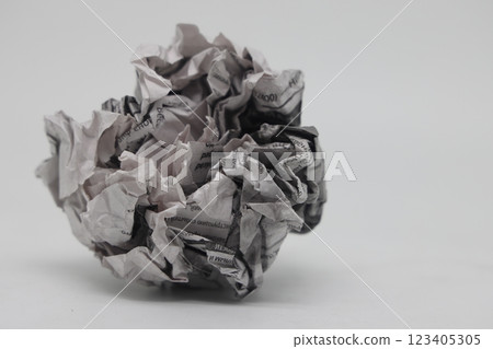 A crumpled piece of newspaper on a white background, fake news, corrupt journalism. A crumpled piece of newspaper on a white background, fake news, corrupt journalism. 123405305