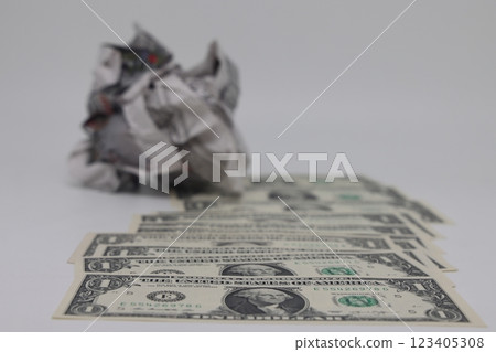 Banknote on the background of a crumpled piece of newspaper on a white background, fake news Banknote on the background of a crumpled piece of newspaper on a white background, fake news 123405308