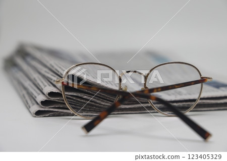 Rolled up stack of newspapers, news, corrupt journalism. 123405329