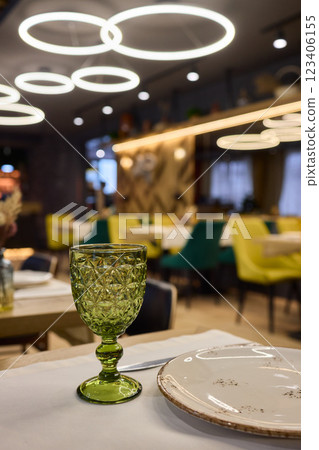A beautifully designed restaurant interior with modern aesthetics and stylish lighting 123406155
