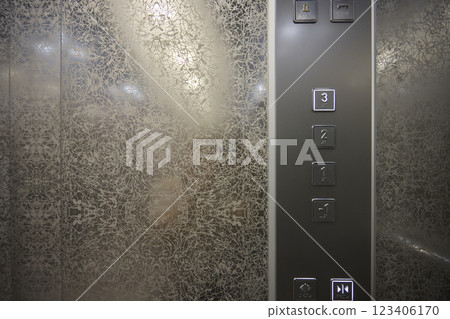The modern elevator control panel features a display showcasing the current floor number The modern elevator control panel features a display showcasing the current floor number 123406170