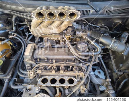 old inline 4 cylinder combustion gasoline engine with dismounted air intake old inline 4 cylinder combustion gasoline engine with dismounted air intake 123406268