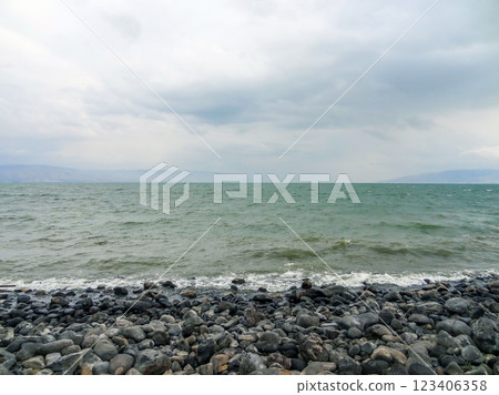 Rocky shore of the sea or lake.The sea of Galilee also called Lake Tiberias or Kinneret, Israel. 123406358
