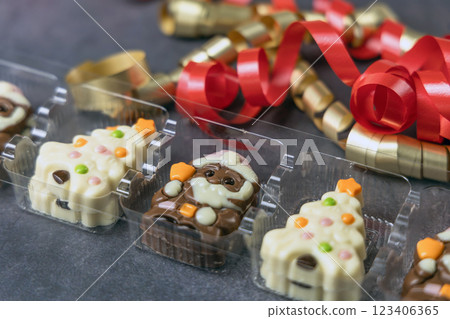 Christmas chocolates. Chocolate Christmas trees and Santa Claus. 123406365