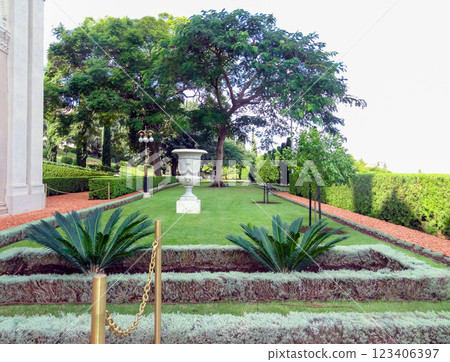 Path in the park with flowers and palm trees on a sunny summer day. Path in the park with flowers and palm trees on a sunny summer day. 123406397