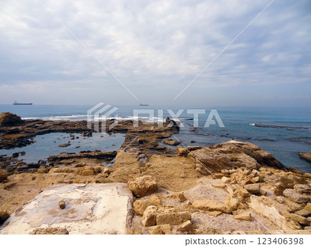 Rocky coast near the ancient Caesarea national park on the Mediterranean coastline, Israel. Rocky coast near the ancient Caesarea national park on the Mediterranean coastline, Israel. 123406398