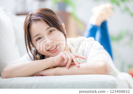 Young woman relaxing in a room 123408632