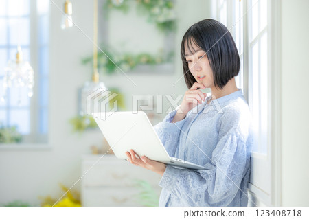A young woman using a personal computer in the room A young woman using a personal computer in the room 123408718