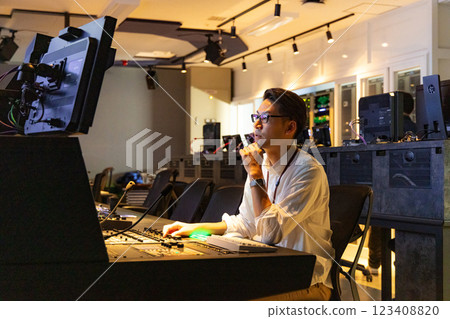A man working at a TV station A man working at a TV station 123408820