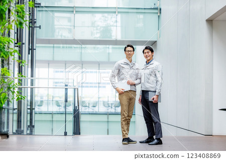 Staff of workers working in an office building Staff of workers working in an office building 123408869