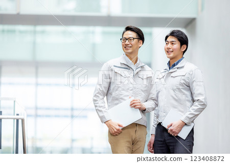 Staff of workers working in an office building Staff of workers working in an office building 123408872