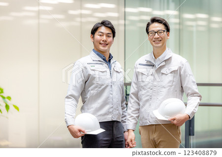 Staff of workers working in an office building 123408879