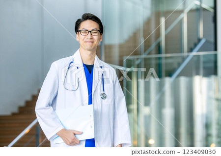 Male doctor in white coat Male doctor in white coat 123409030