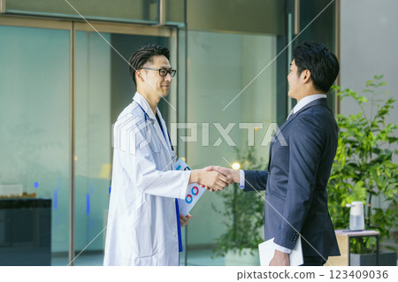 Doctors shaking hands in hospital 123409036
