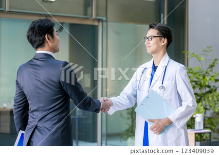 Doctors shaking hands in hospital 123409039