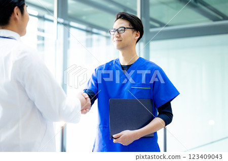 Doctors shaking hands in hospital 123409043
