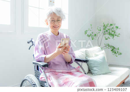 Senior woman making a phone call 123409107