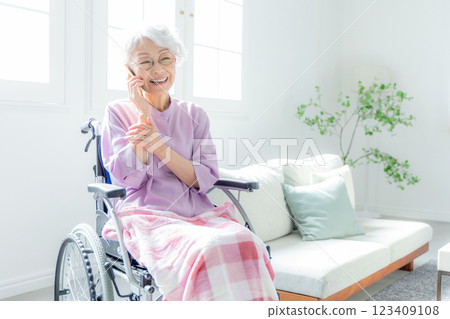 Senior woman making a phone call 123409108