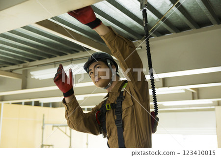 A man working at a construction site A man working at a construction site 123410015