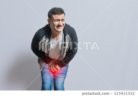 Medical problem urinary incontinence. people with crotch pain, Person with urinary problems, Man with hands on crotch with urinary problems Medical problem urinary incontinence. people with crotch pain, Person with urinary problems, Man with hands on crotch with urinary problems 123411332
