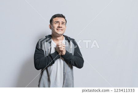 Distressed man asking for a favor, People putting hands together asking please, Hopeful person asking for help or apologizing, Person pleading with hands together isolated. Distressed man asking for a favor, People putting hands together asking please, Hopeful person asking for help or apologizing, Person pleading with hands together isolated. 123411333
