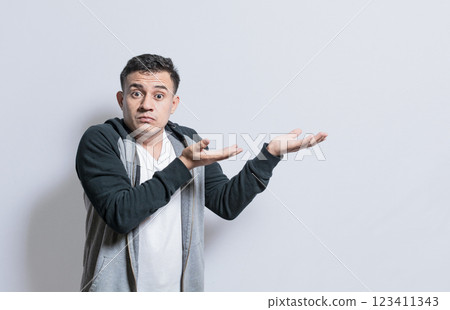 Person pointing palms to the side, Shocked people pointing both hands to the right, Shocked guy pointing his hands to the side of space 123411343