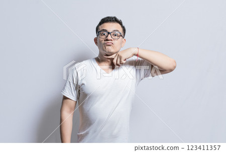 Person threatening with a finger to the throat, A person threatening to kill, A man with a violent look making threatening signs Person threatening with a finger to the throat, A person threatening to kill, A man with a violent look making threatening signs 123411357