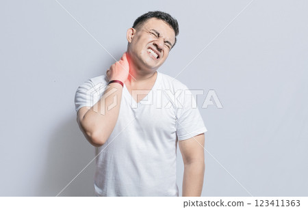 Man with neck and back muscle pain, Close up of man with neck and back pain, a man with muscle pain on isolated background, Neck and back pain concept Man with neck and back muscle pain, Close up of man with neck and back pain, a man with muscle pain on isolated background, Neck and back pain concept 123411363