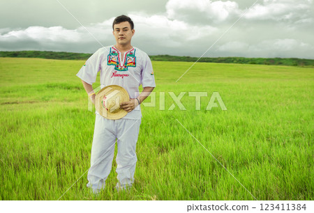 Young man in cultural and folk costume from Nicaragua. Concept of man in Nicaraguan folk costume, Nicaraguan man in folk costume in the field, Man wearing Central American folk costume Young man in cultural and folk costume from Nicaragua. Concept of man in Nicaraguan folk costume, Nicaraguan man in folk costume in the field, Man wearing Central American folk costume 123411384
