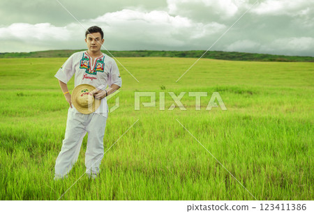 Nicaraguan man in folk costume in the field, Concept of man in Nicaraguan folk costume. Man wearing Central American folk costume, Young man in cultural and folk costume from Nicaragua Nicaraguan man in folk costume in the field, Concept of man in Nicaraguan folk costume. Man wearing Central American folk costume, Young man in cultural and folk costume from Nicaragua 123411386