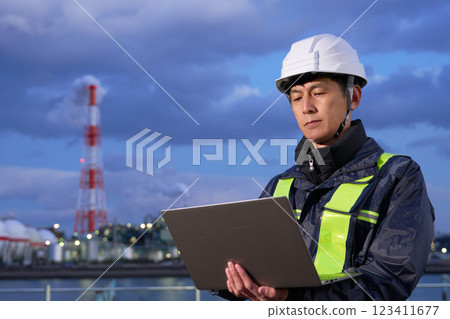 Worker using a PC outdoors Worker using a PC outdoors 123411677